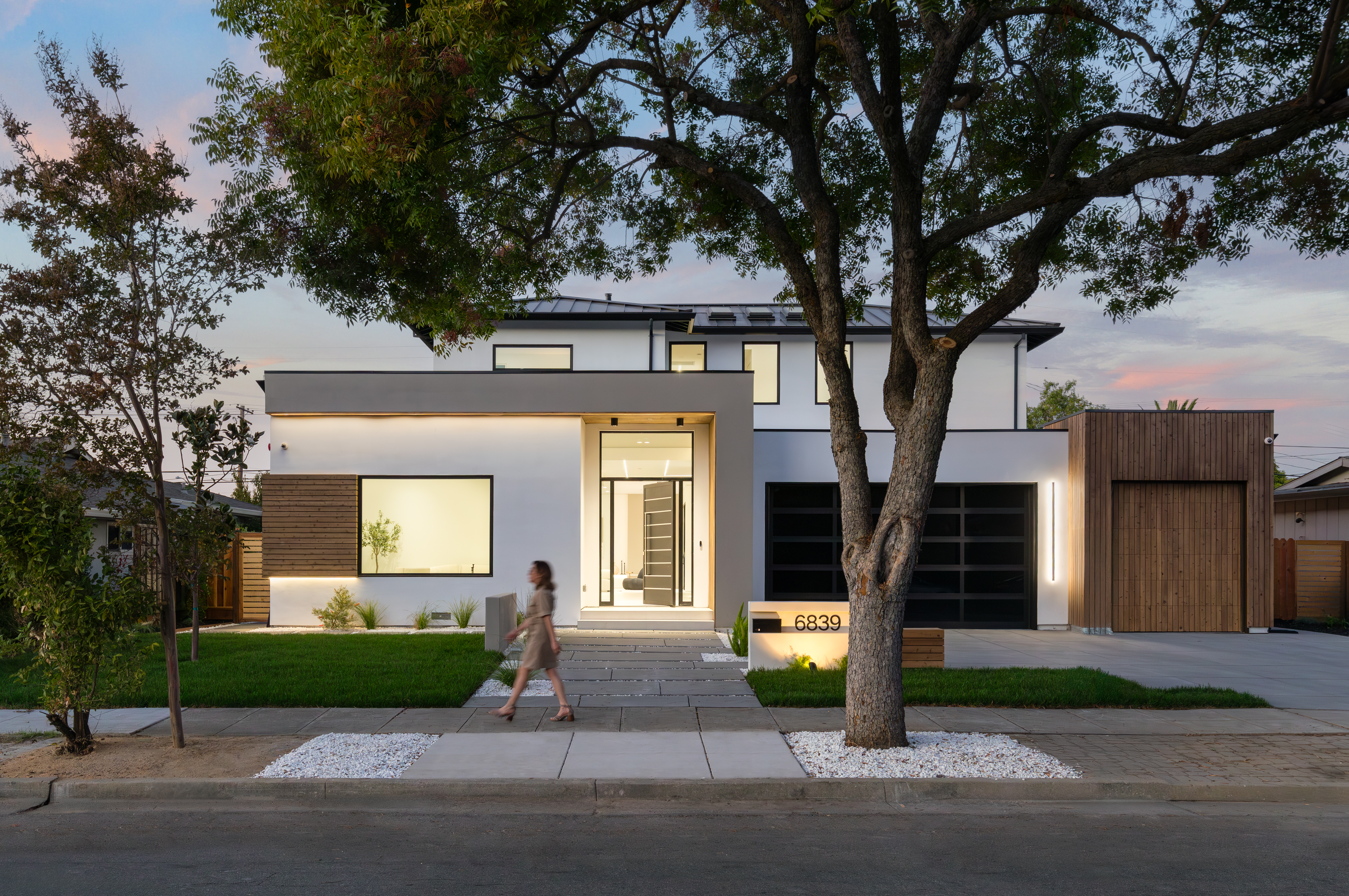 Los Gatos hillside custom home exterior with protected trees and design-build planning
